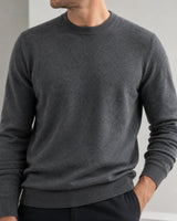 Close-up of men's classic soft knit crew neck sweater with fine-gauge knit texture